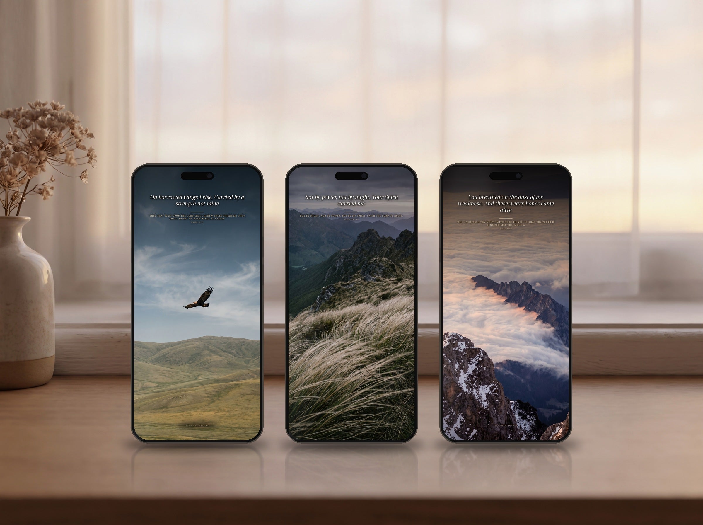 All three phone wallpapers from this set shown on three phones